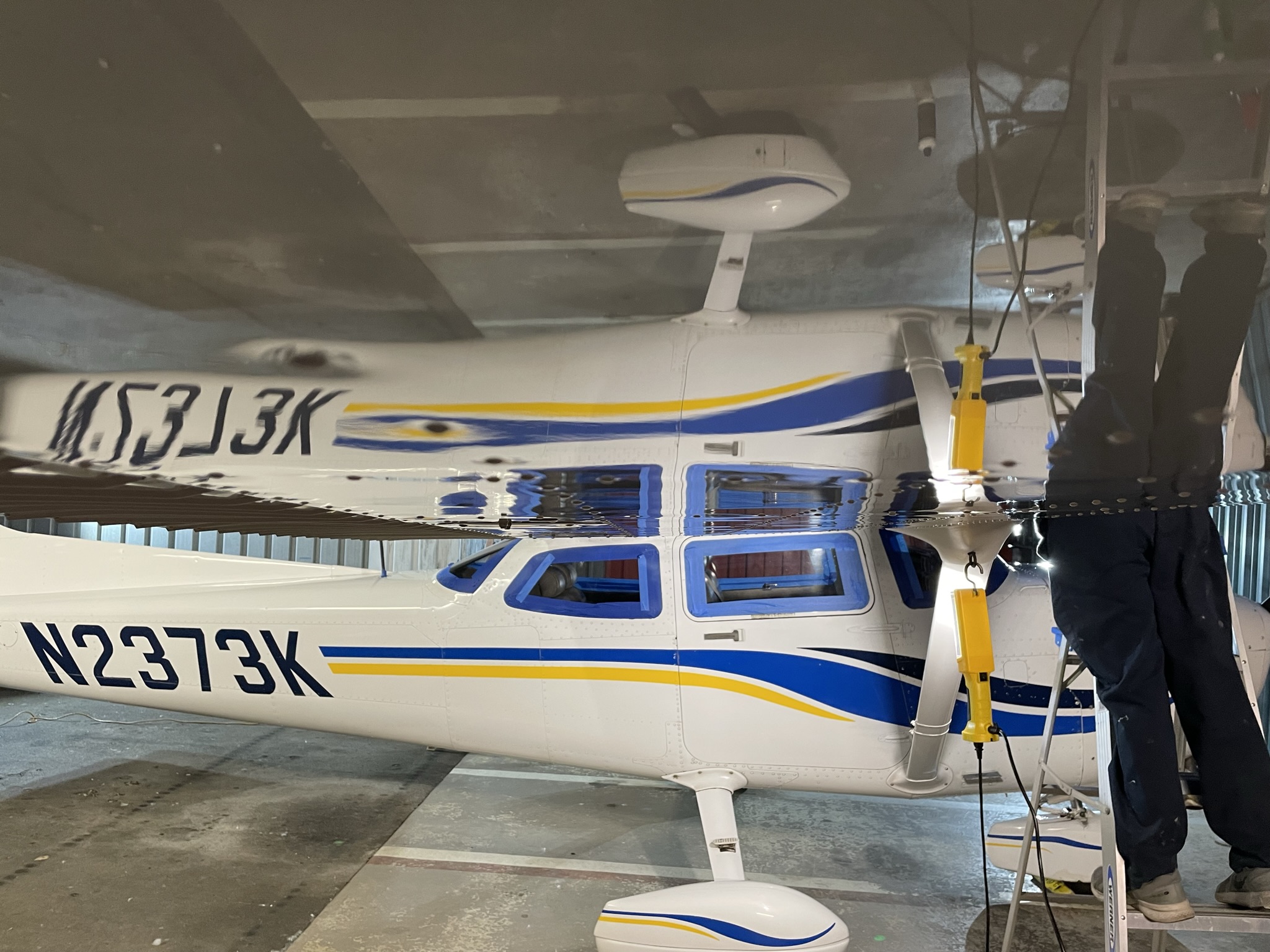 Professional detailing Permagard application leaving a mirror finish on the Cessna 182 wings